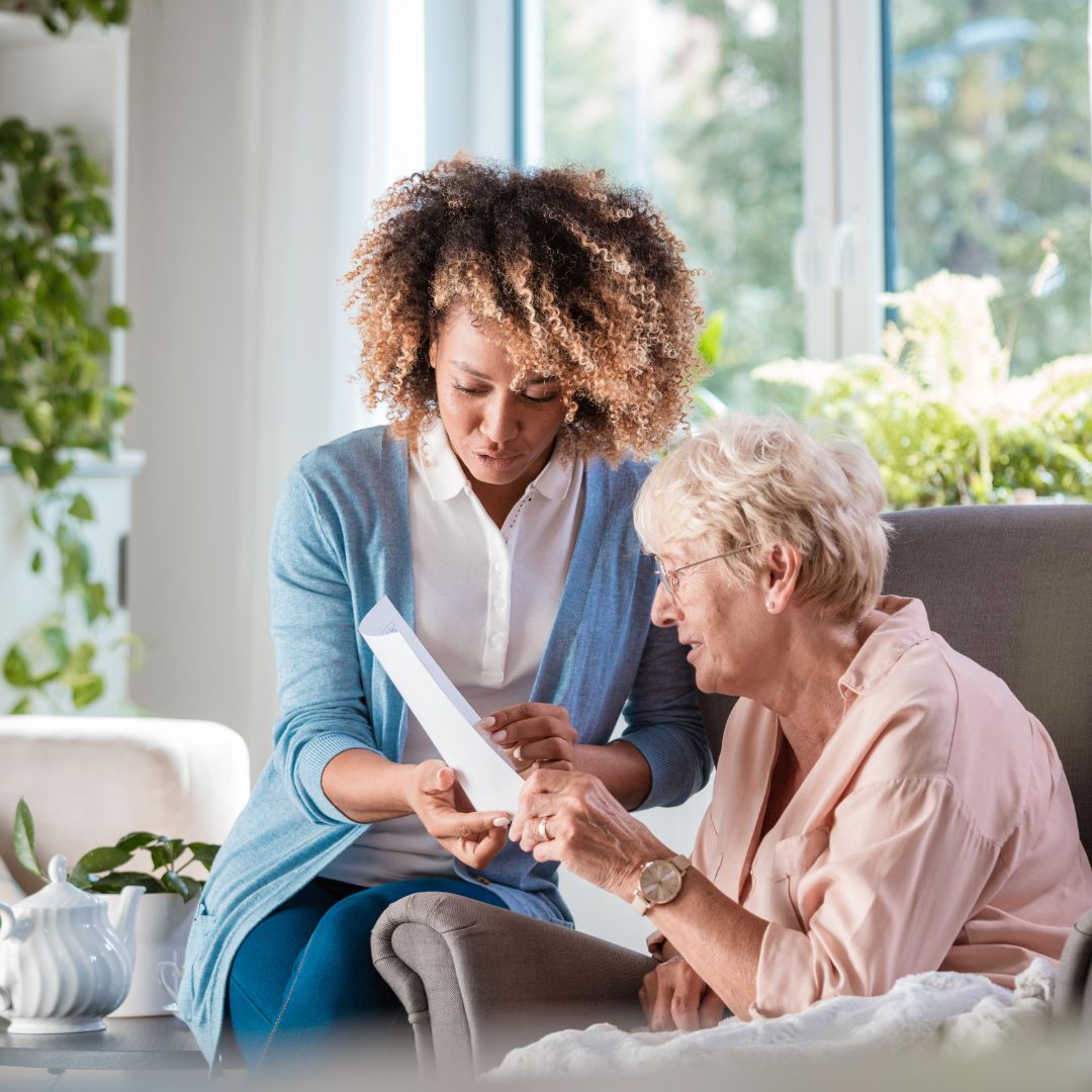 Home care worker looking over things with senior