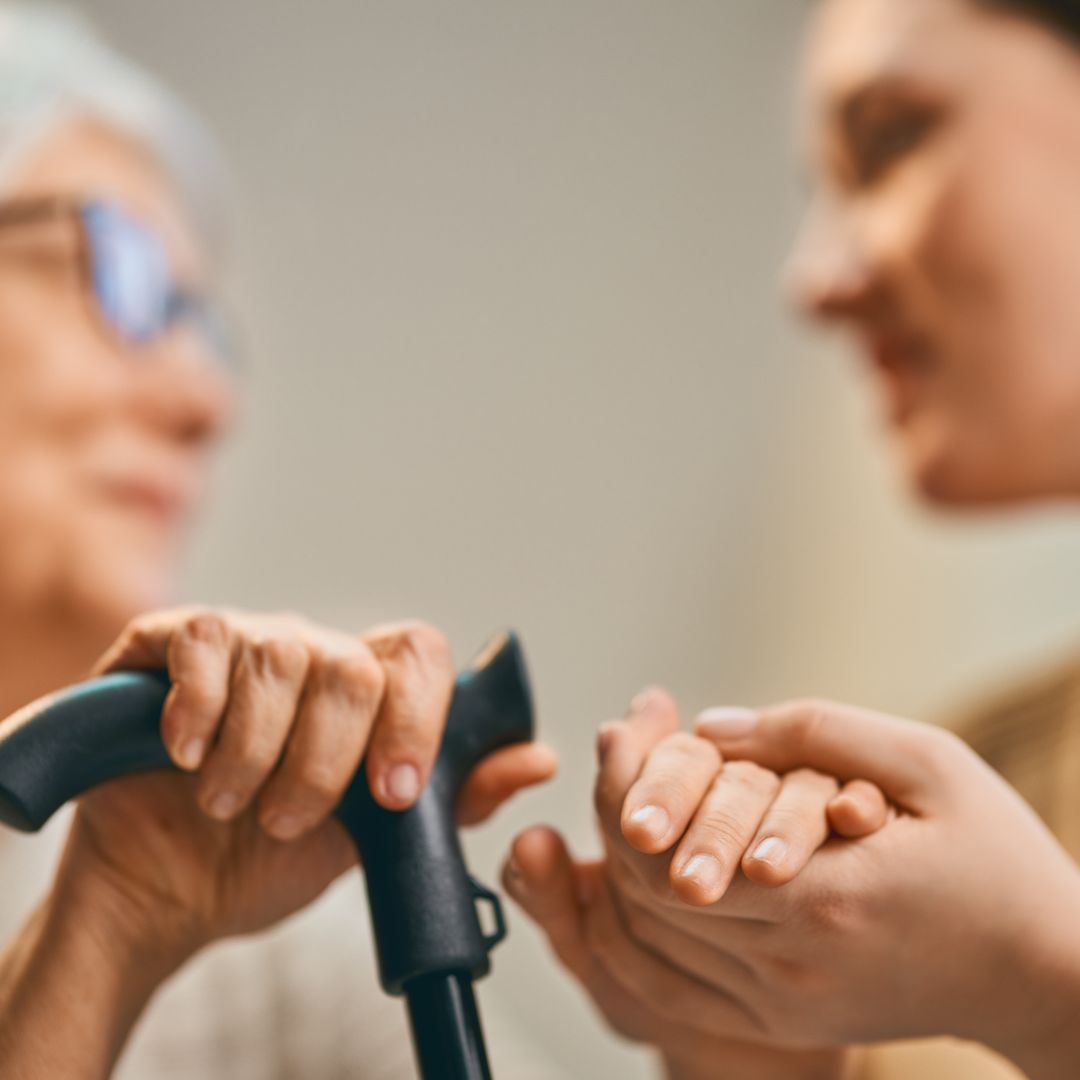 Caregiver smiling at senior