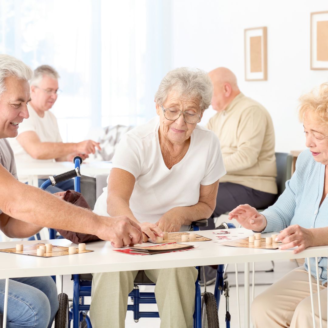 Eldlery playing a board game